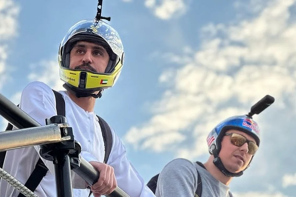 Watch: UAE pilot leaps from Burj Khalifa in kandura with 31 base jumpers