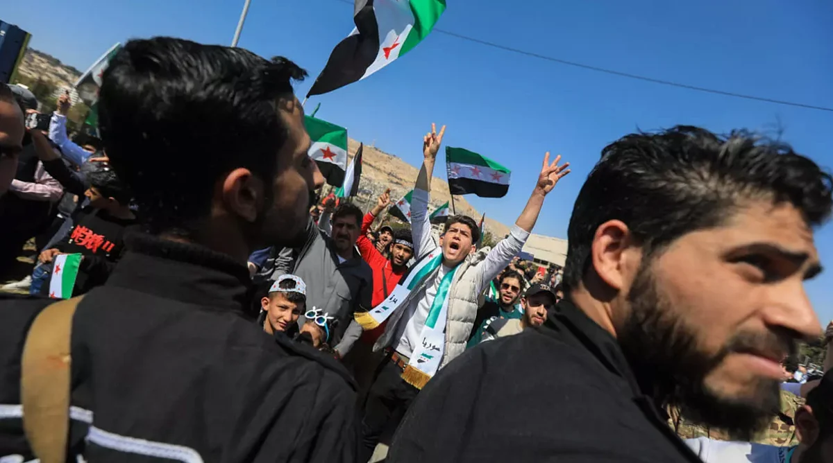 Syrians celebrate 14th anniversary of uprising with historic rally in ...