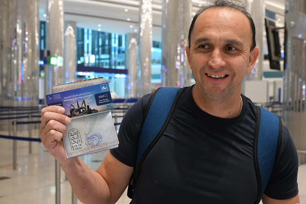 A traveller with the 'Eid in Dubai' stamp on his passport.&nbsp;Photo:&nbsp;x.com/DXBMediaOffice