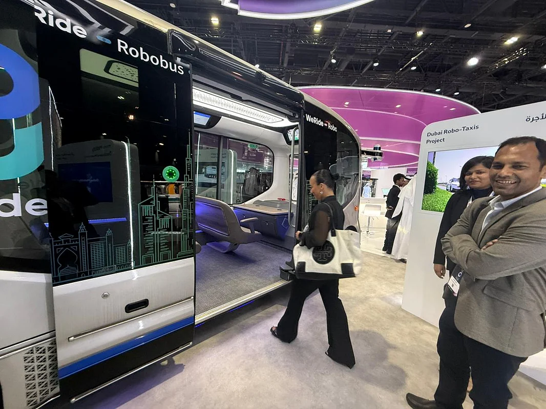 Raya Al Samaraie, from MWB Design Services and a visitor at Dubai World Congress and Challenge for Self-Driving Transport , hopping on the self-driving shuttle bus that will be used within Dubai Autonomous Zone.