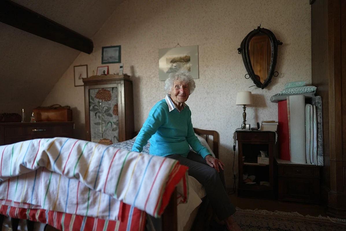 Charlotte Chopin sits on her bed at her home in Léré, France on Sept. 17. 2025. 