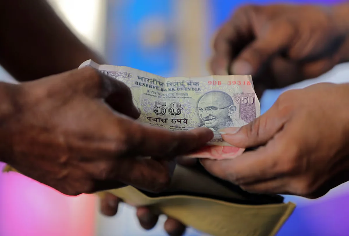 Indian rupee falls most in a month as traders cut long bets, importers buy dollars