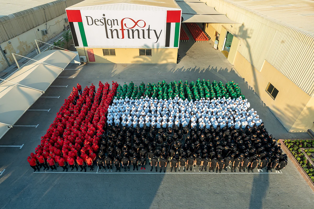 Design Infinity marks UAE National Day with its 1,400-member team at the Glass, Metal & Signage Factory