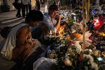 Australia falls silent, lights candles for Bondi Beach shooting victims