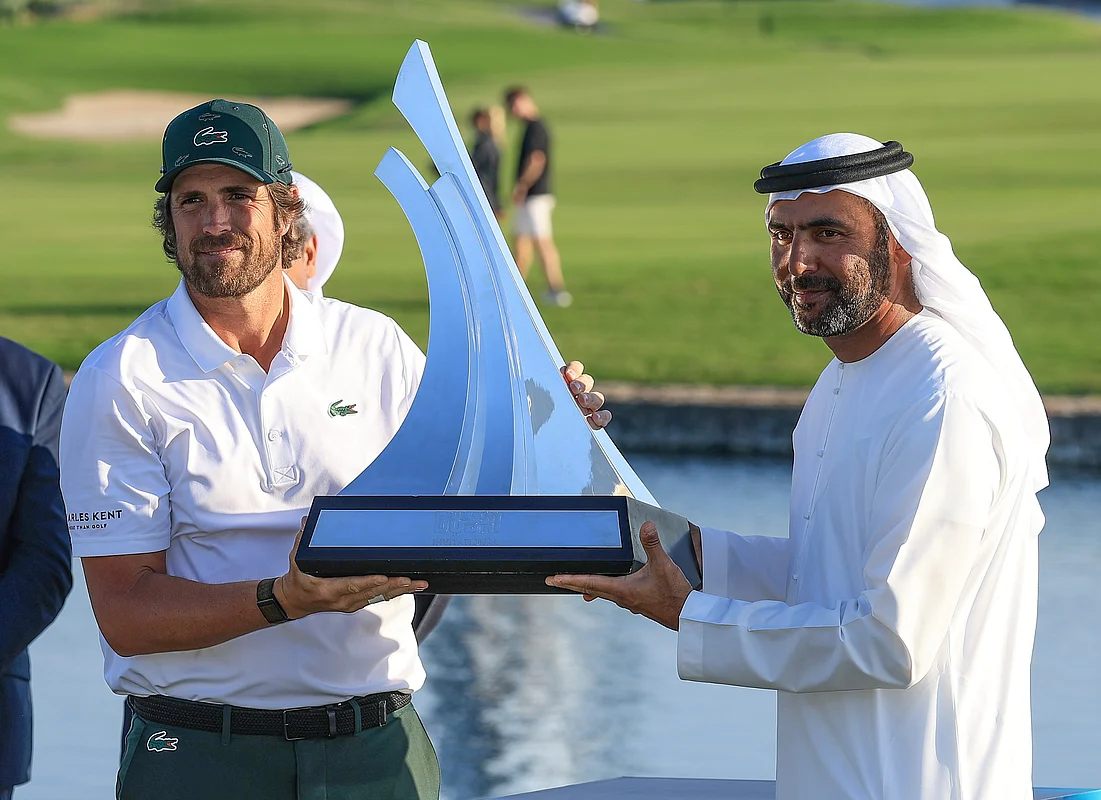 Nacho Elvira celebrates a dramatic Dubai Invitational triumph with Tournament Host Abdullah Al Naboodah. - Photo Dubai Invitational.