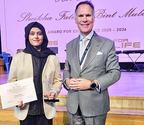 Carl Roberts, Executive Principal, CEO of The Westminster School, Dubai, and Brand Ambassador for Westminster Schools, and Hareem Rizvi with Sheikha Fatima Bint Mubarak Award for Excellence.