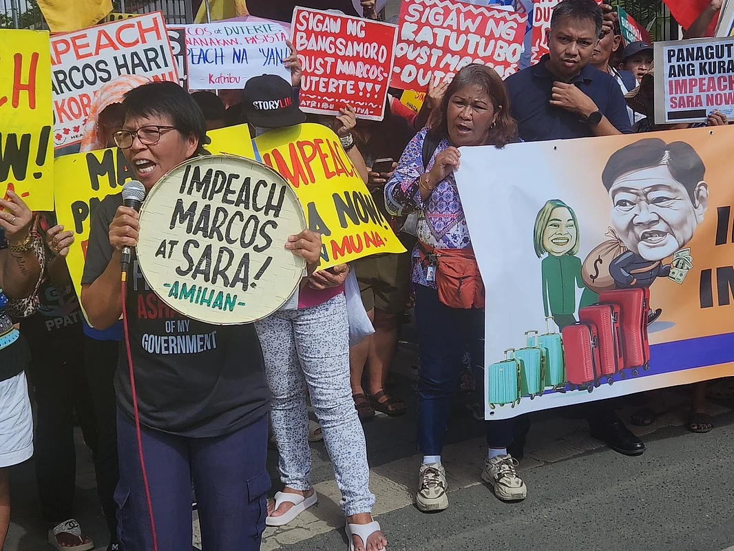 Protesters in front of the Philippine House of Representatives during the hearing of impeachment complaints against President Marcos