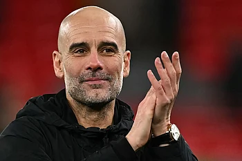 Man City's Guardiola shrugs off title speculation, calls for more consistency