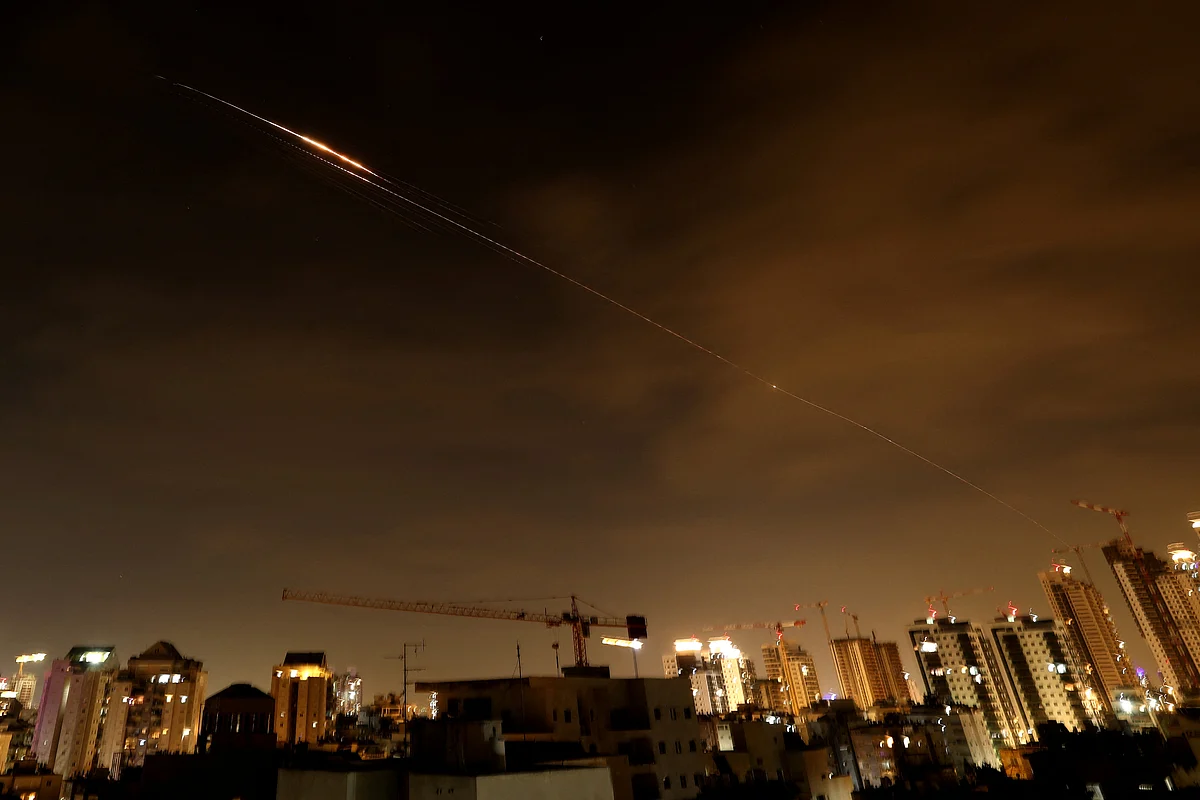 Rocket trails are seen in the sky amid a fresh barrage of Iranian missile attacks above the Israeli coastal city of Netanya on March 23, 2026.