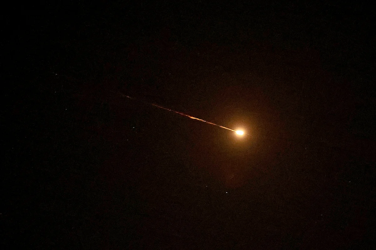 A rocket trail is seen in the sky above the Israeli coastal city of Netanya amid a fresh barrage of Iranian missile attacks on March 24, 2026.