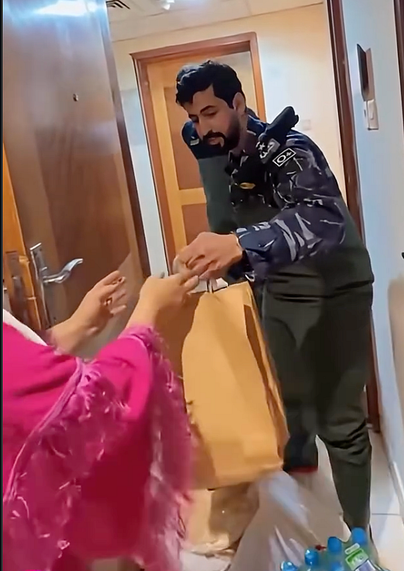 Watch: Ajman Police deliver food, supplies to family's doorstep amid heavy rains