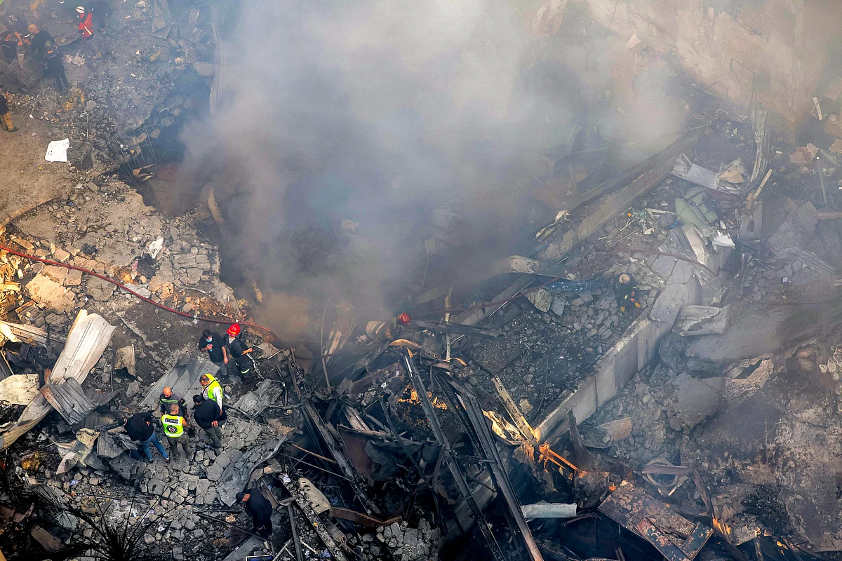 Firefighters attempt to extinguish a fire following an Israeli strike at the Corniche al-Mazraa neighbourhood of Beirut on April 8, 2026.