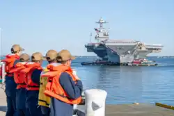 Iran to announce traffic mechanism for Hormuz; US aircraft carrier returns from region