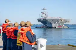 Iran to announce traffic mechanism for Hormuz; US aircraft carrier returns from region