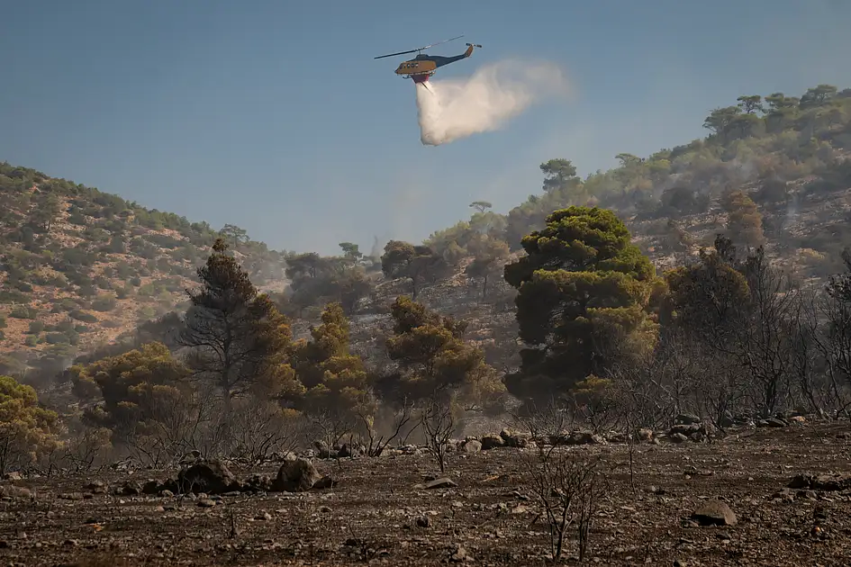 Two Rime Two dead, hundreds evacuated from fires on island near Athens | Khaleej ...