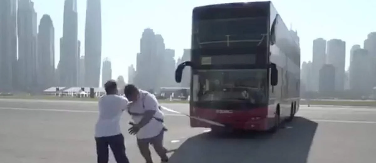 Video: Dubai 'strongman' pulls double-decker bus as part of Fitness ...