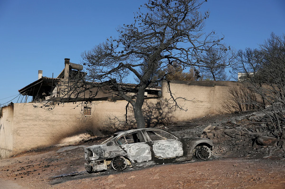 Greek wildfire eases in Athens suburbs for now, leaving one woman dead ...