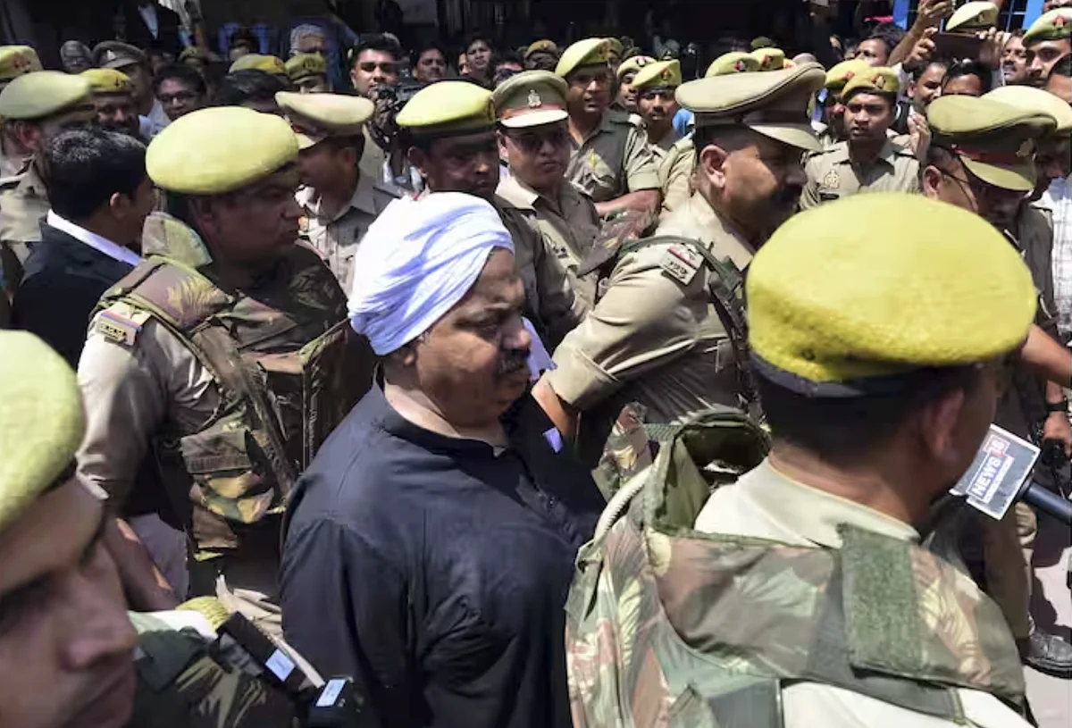 India: Gangster-turned-politician, brother shot dead while being taken ...