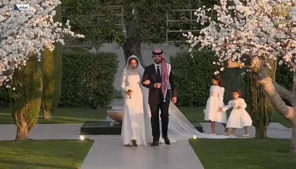 princess iman of jordan wedding dress For Jordan's Princess Iman, @MariaGraziaChiuri incorporated delicate floral details into the collar and sleeves of her sleek wedding dress. Contemporary yet timeless, the white gown is adorned with immaculate lace work and