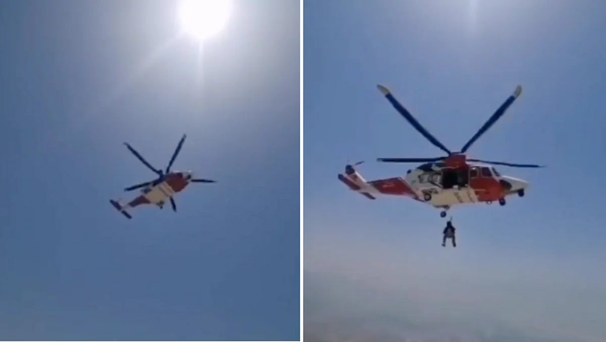 Watch: Helicopter airlifts injured man after he falls from mountain in ...