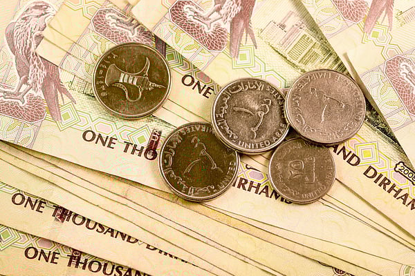 Dirhams currency note and coins